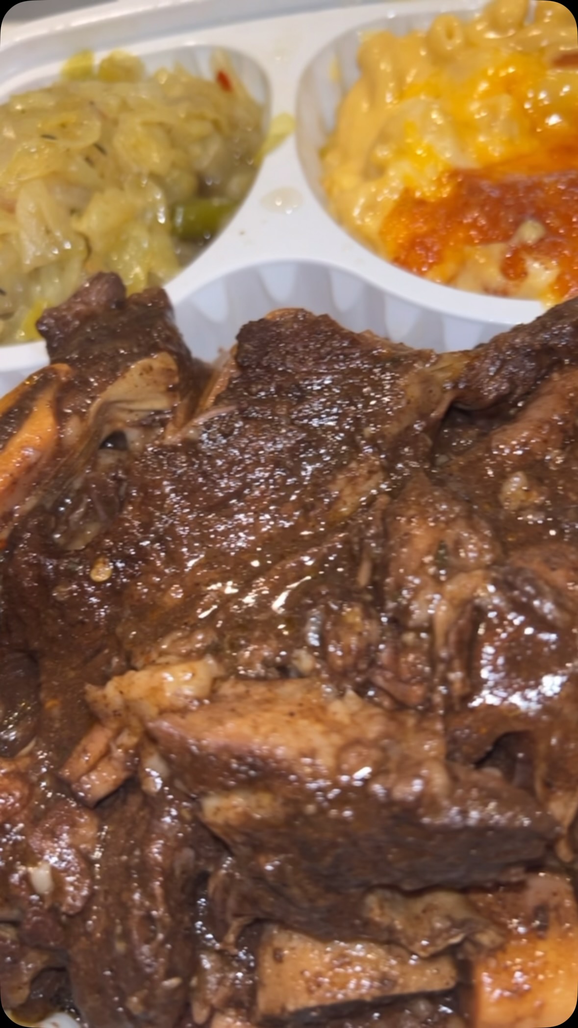 Braised oxtails with cabbage and mac and cheese