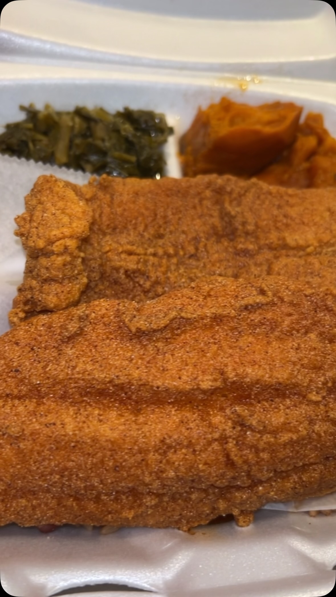 Fried catfish with collard greens and candied yams